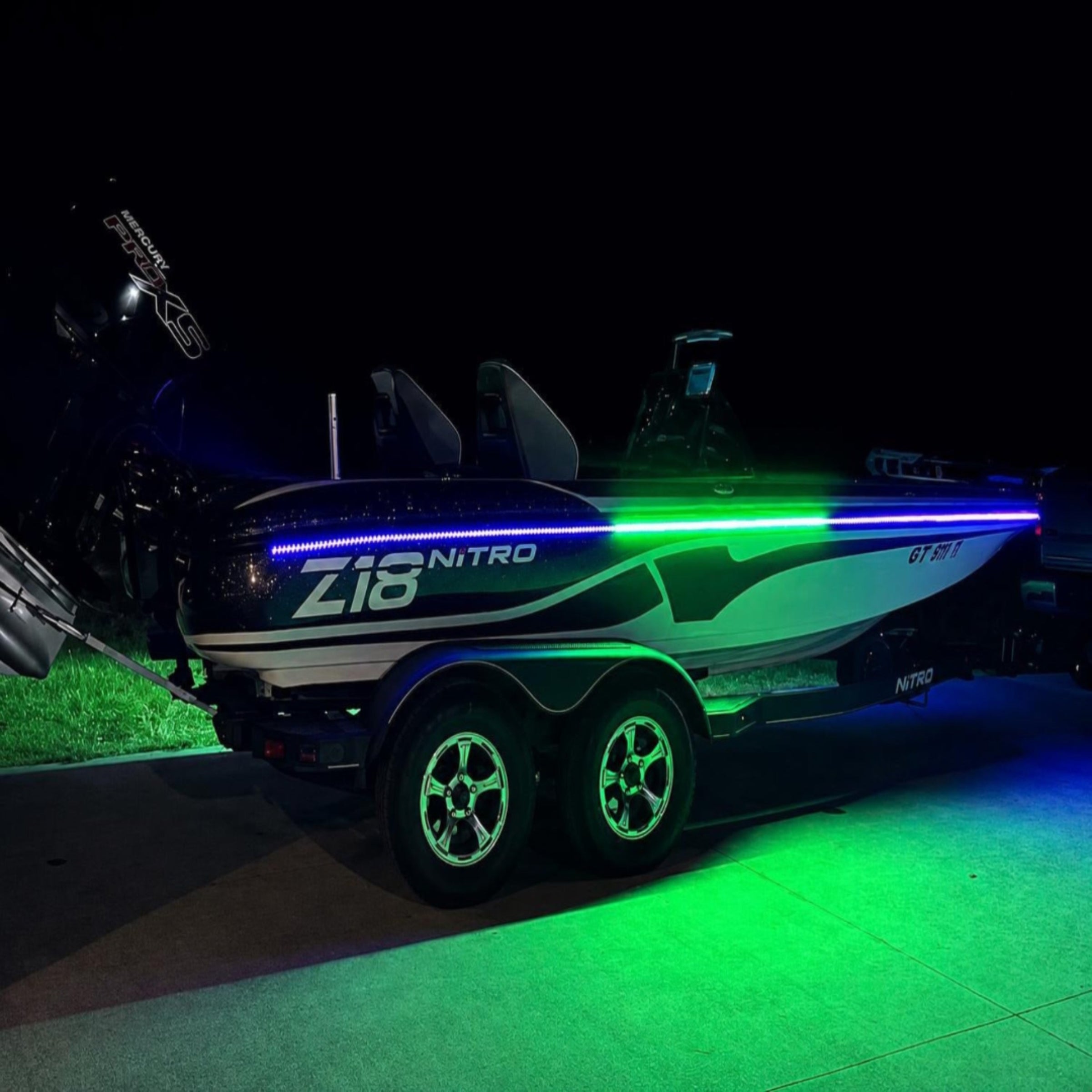Nitro boat with glowing green lights on a dark background